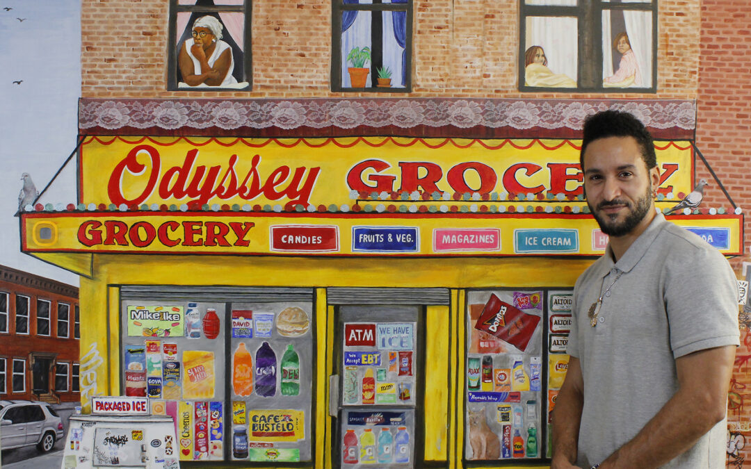 Adult male artist standing next to his painting of a NYC bodega