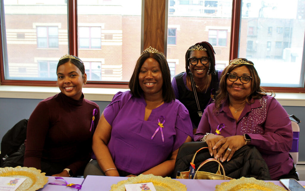 A group of women sitting together at a Women's Day event