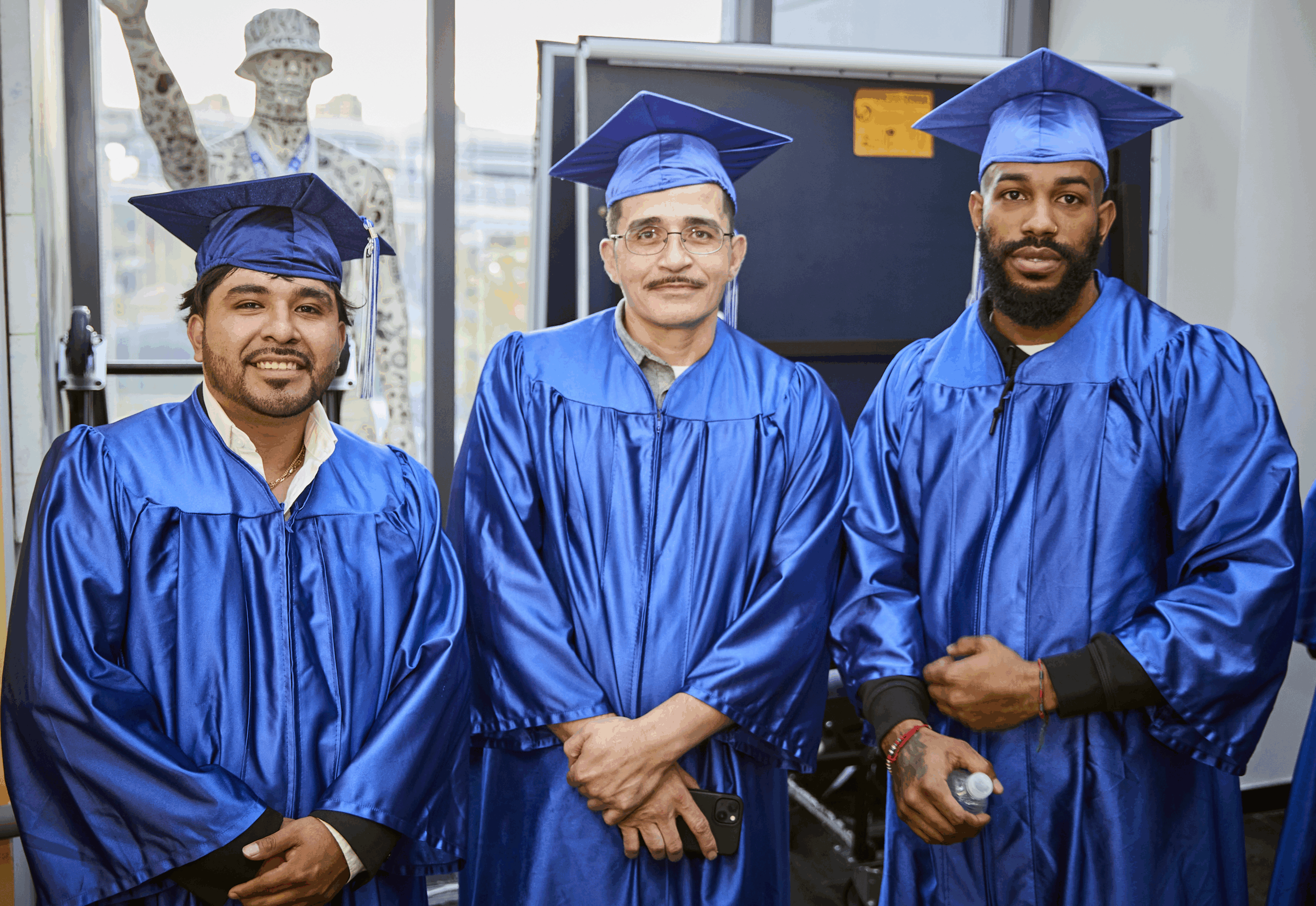 Three male graduates